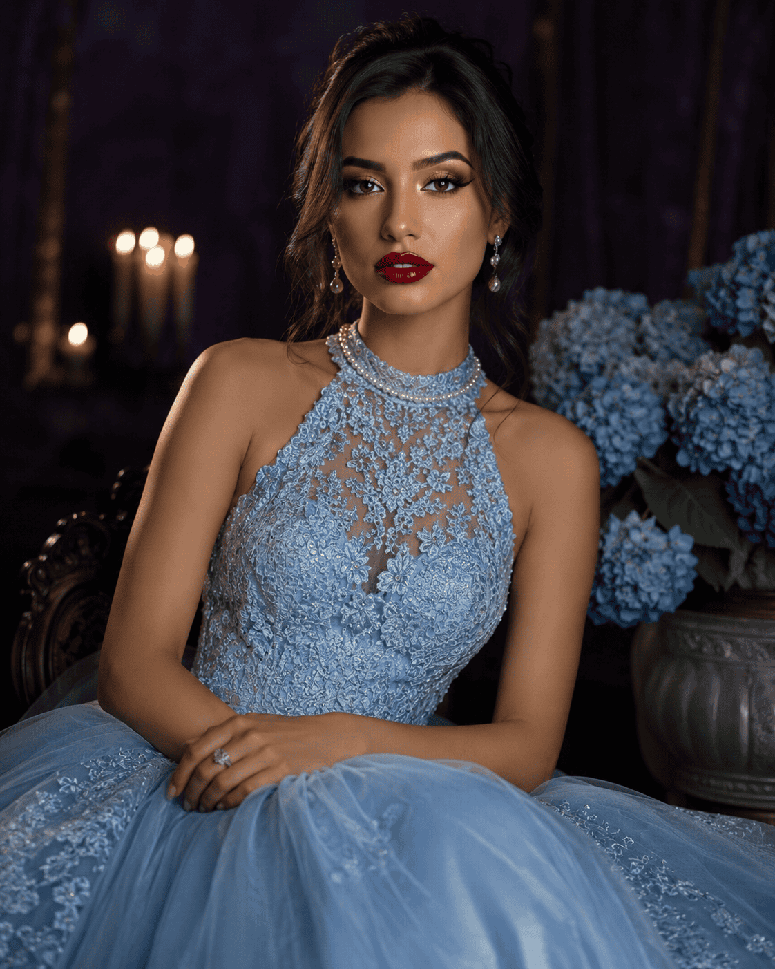 Elegant woman in a light blue lace ballgown posing in a cinematic portrait with a purple backdrop, candlelight, and blue hydrangea flowers.
